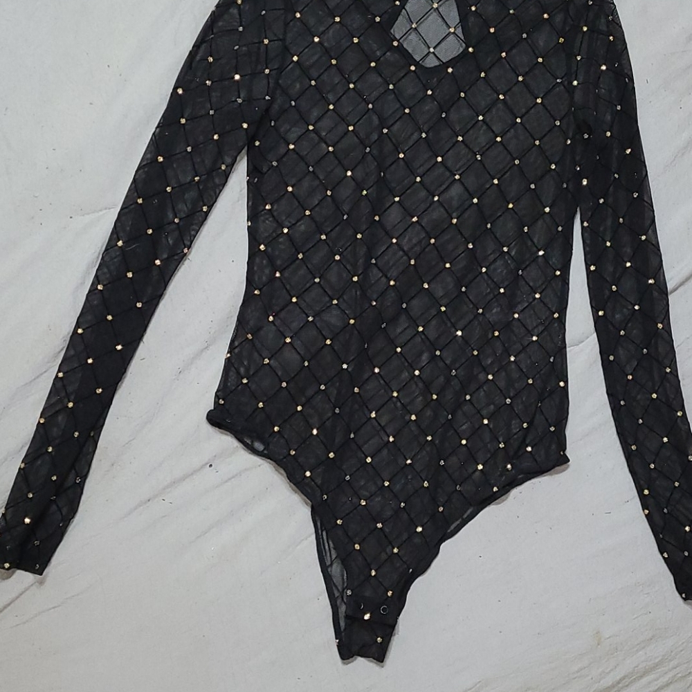 Sheer black bodysuit with gold accents